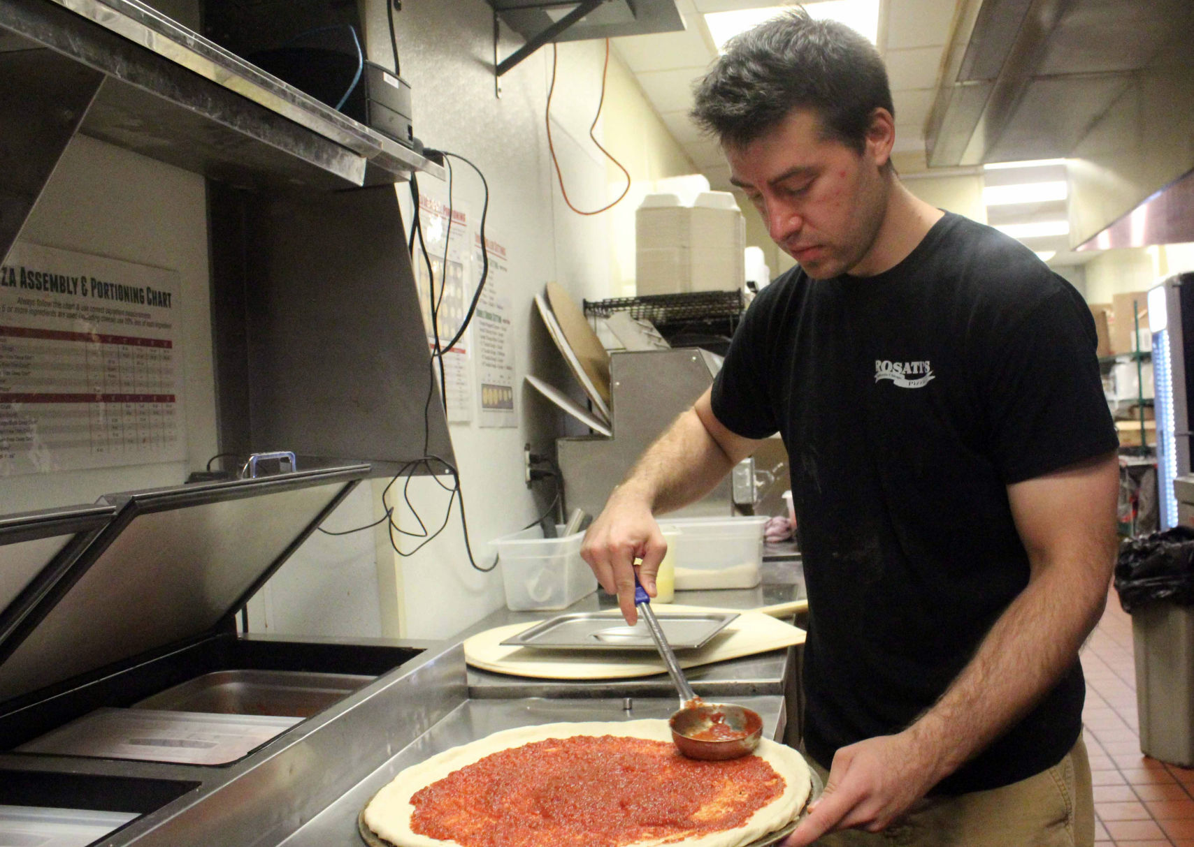 Christopher makes pizza